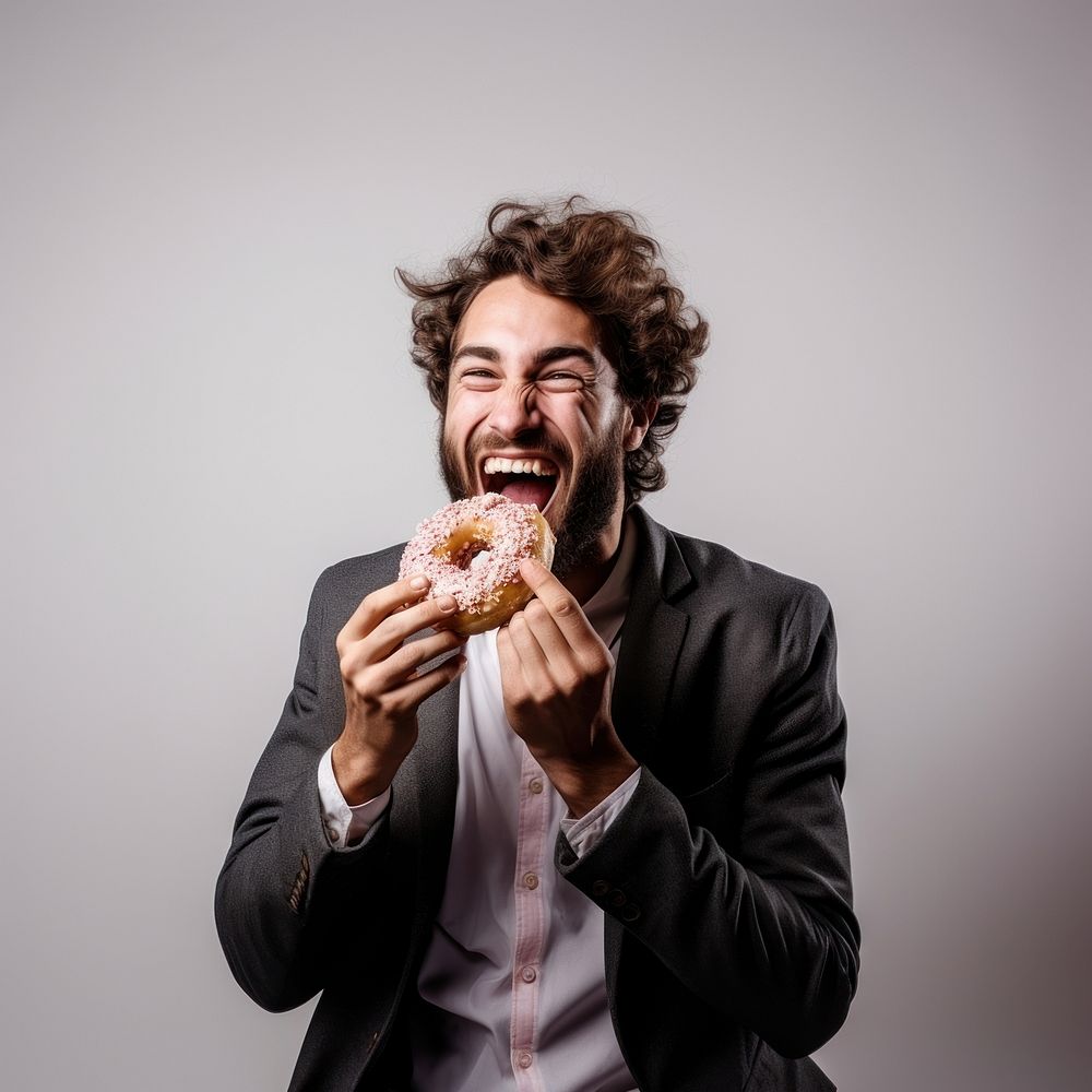 Donut biting eating adult. 