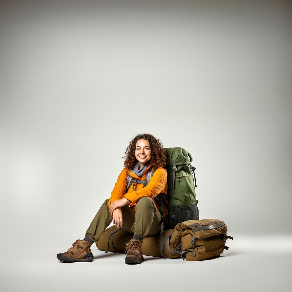 Backpack smiling sitting adult. AI generated Image by rawpixel.