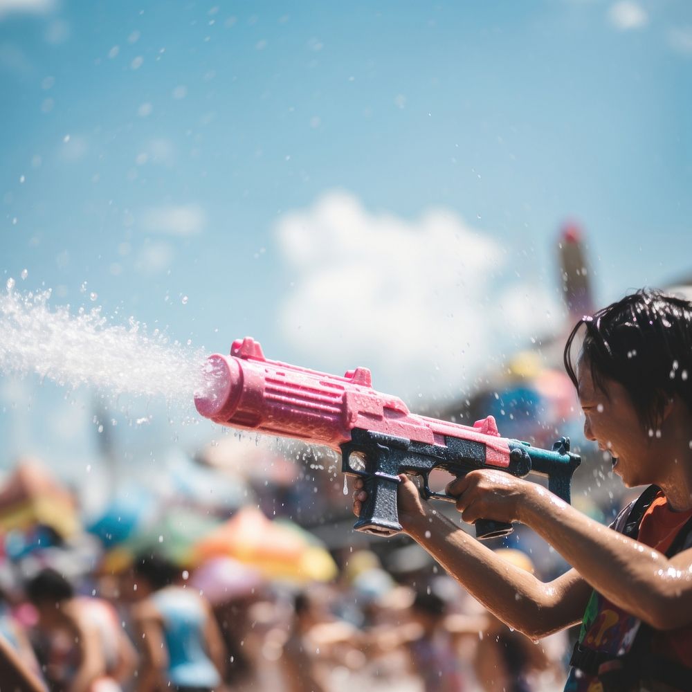 Songkran festival person gun performance. AI generated Image by rawpixel.