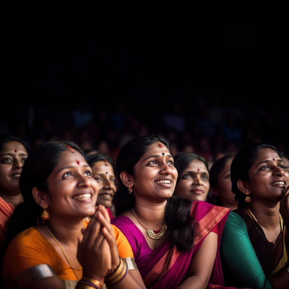 Photography of Unusual looking 36yo south Indian women speacking watching concert.  