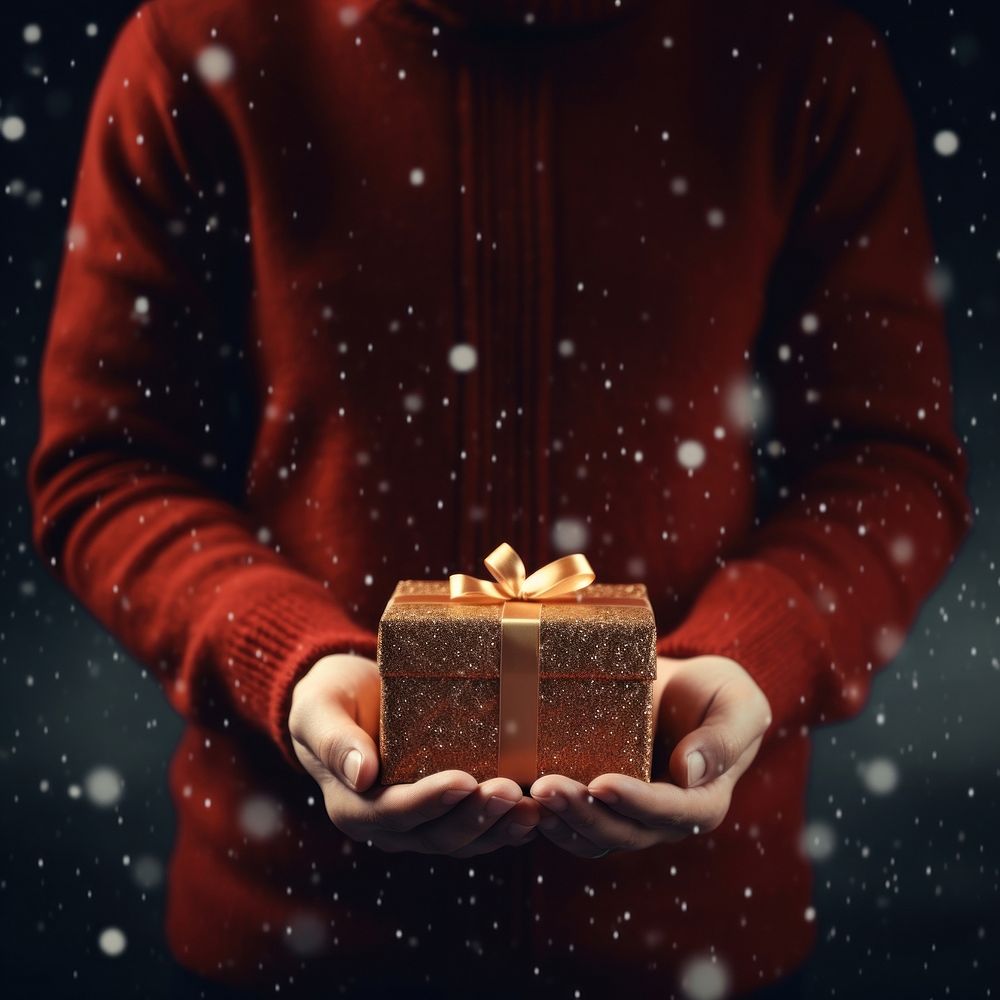 People holding christmas gift food gingerbread illuminated. 