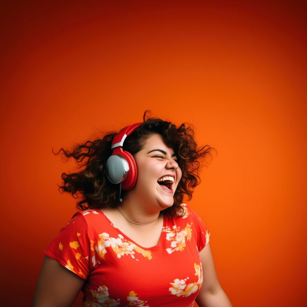 Woman wearing headphones laughing portrait smiling. AI generated Image by rawpixel.