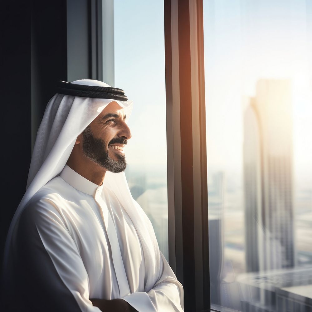 Photo of an Arabic businessman looking out of a window. AI generated Image by rawpixel.