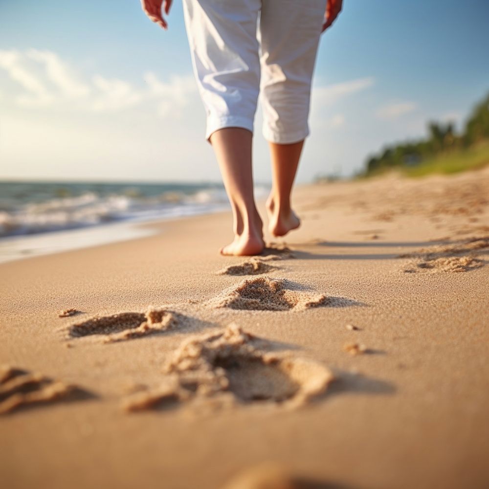 Human footsprint on sand beach in summer,. 