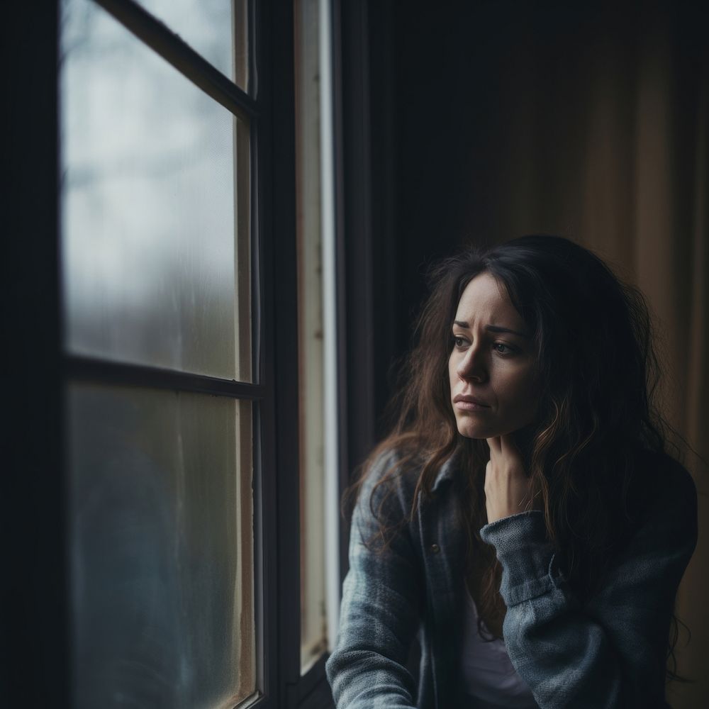 image of sad person looking out window. AI generated Image by rawpixel.