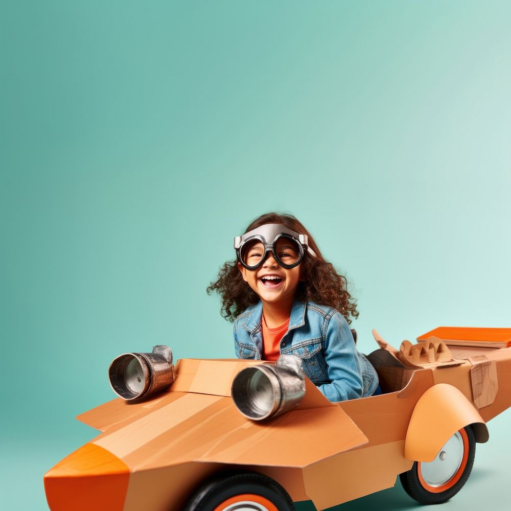 Little girl flying a cardboard airplane. 