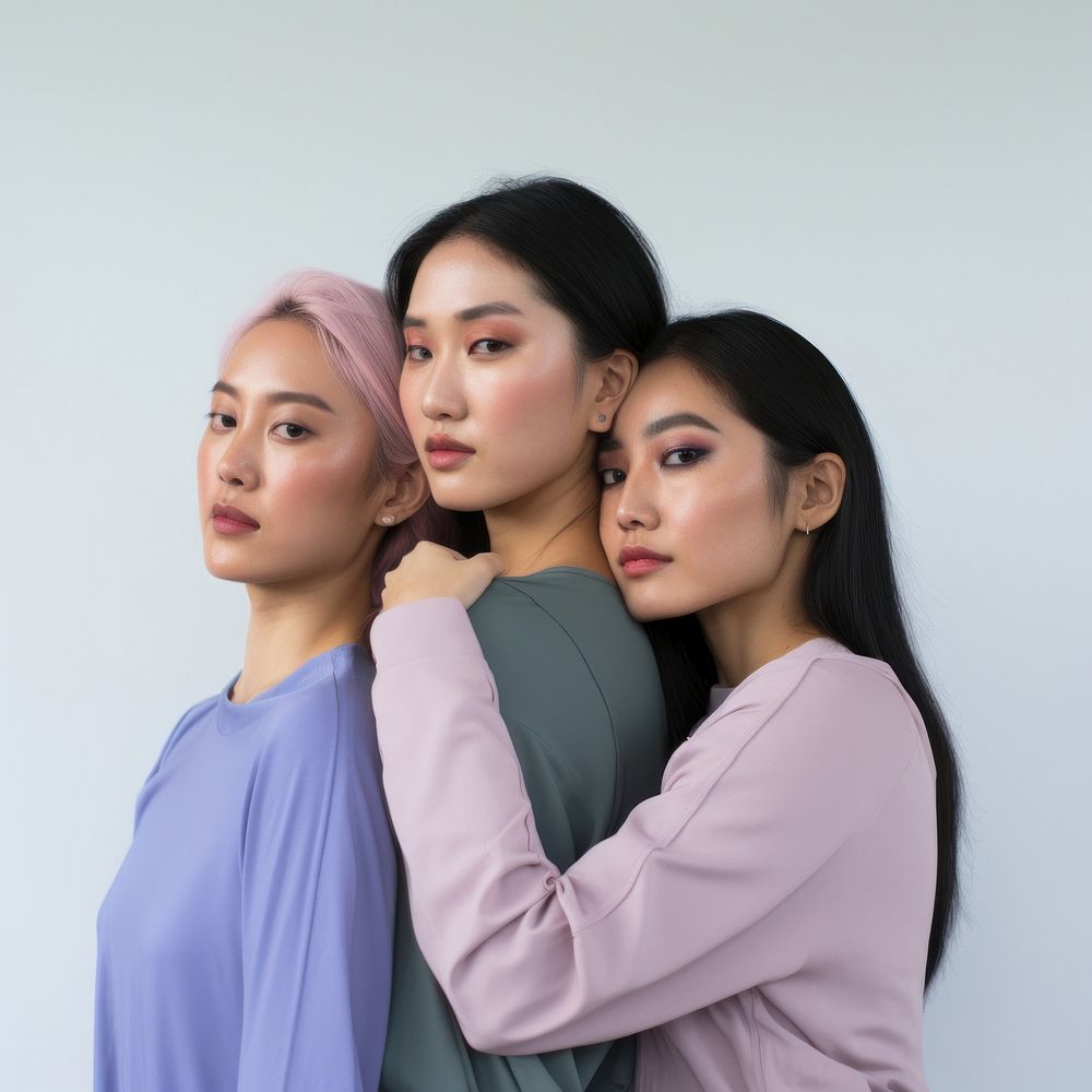 Three young asian women portrait standing looking