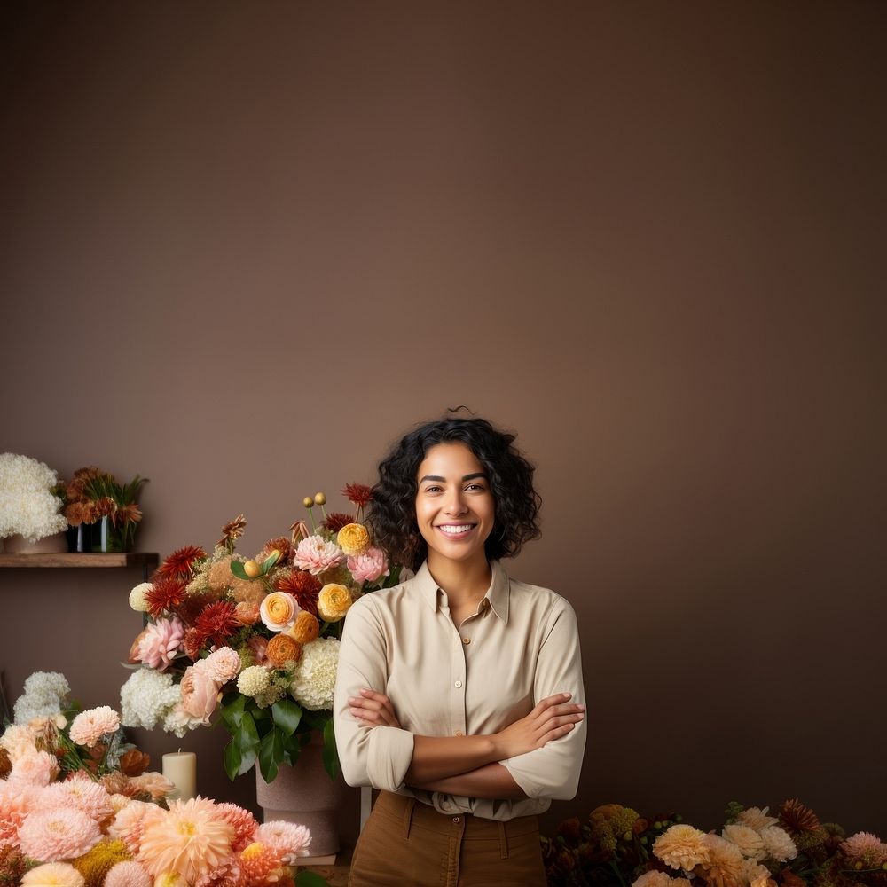 photo of a smiling florist looking at the camera studio shot isolated on a solid background.  