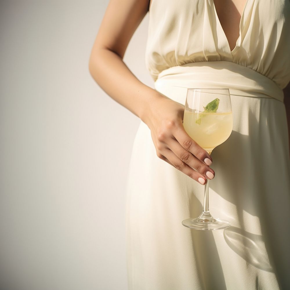 Woman hand holding cocktail fashion drink dress. AI generated Image by rawpixel.