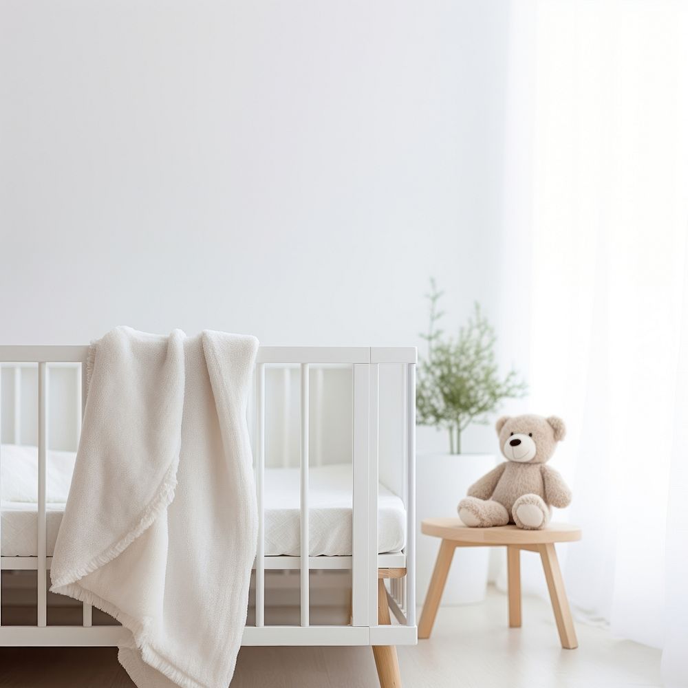 Photograph, close up shot, a white Blanket Mockup Featuring a baby crib in a Nursery room background.  