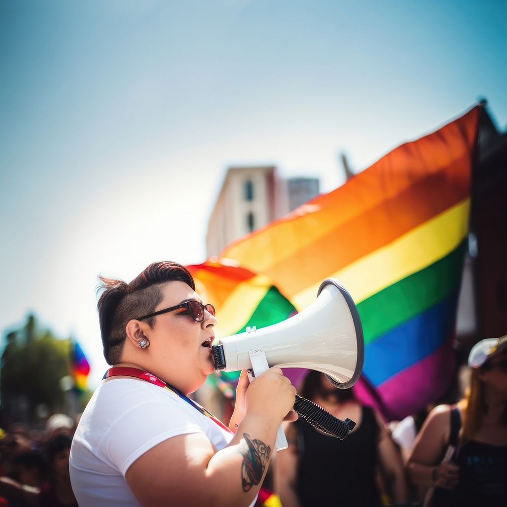 photo of plus size mexican lesbian woman using a megaphone at a pride parade. AI generated Image by rawpixel. 