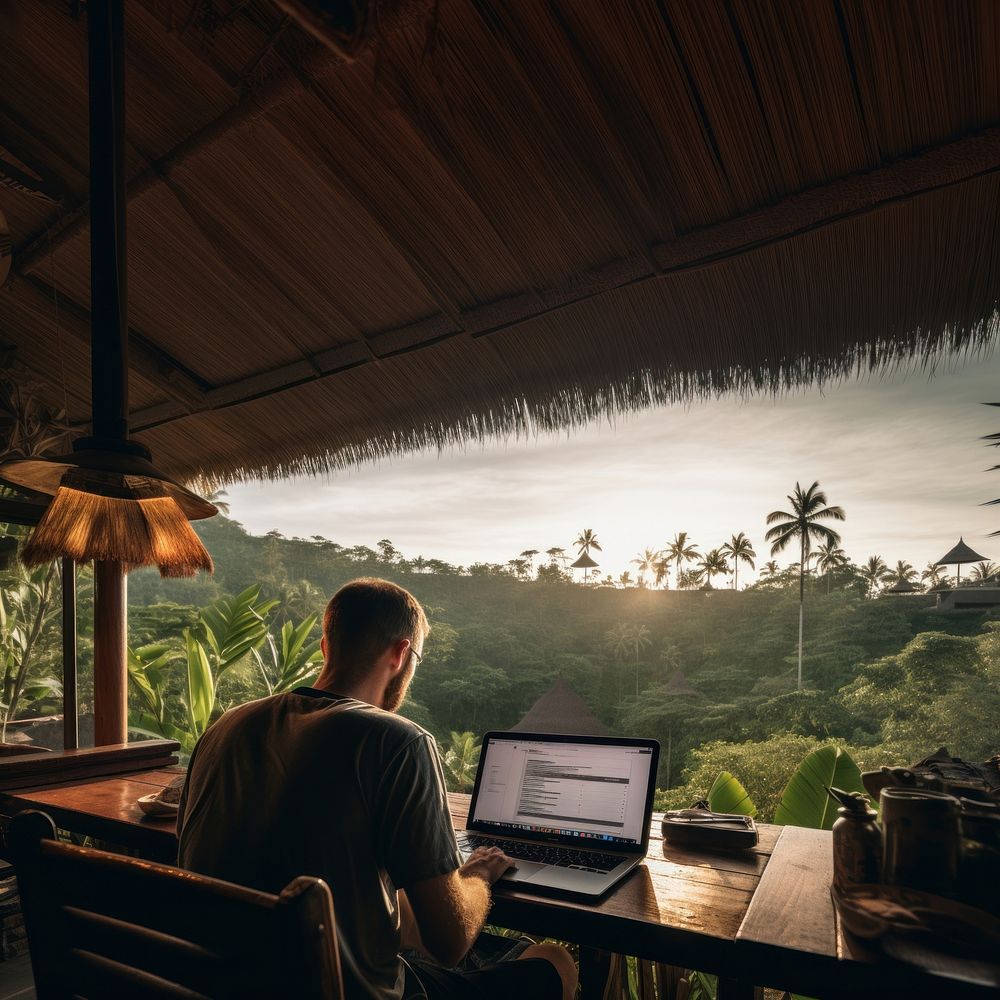 photo of man working from his laptop in bali. AI generated Image by rawpixel. 