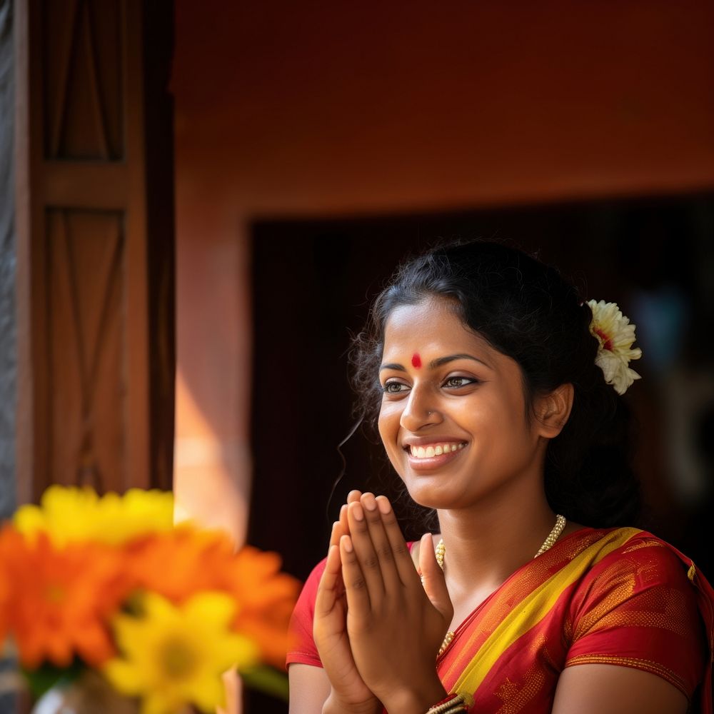 Sri Lankan woman performing a traditional welcoming gesture.  