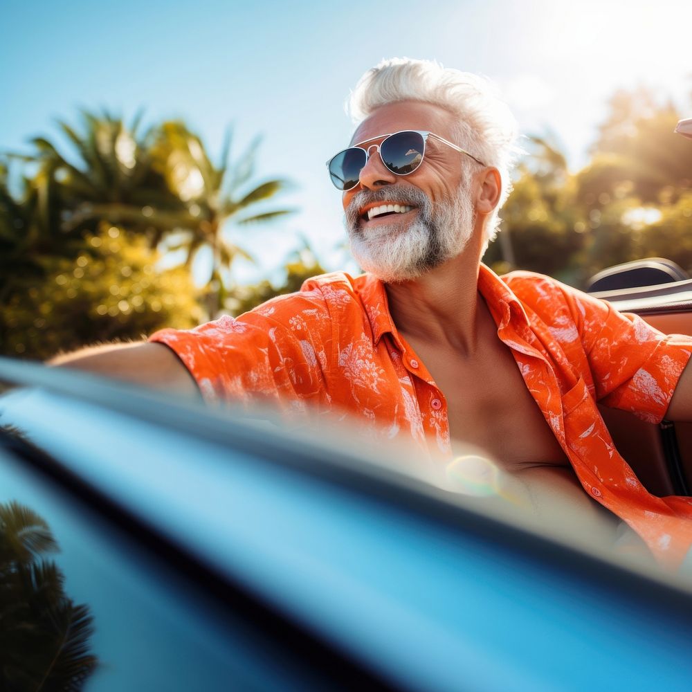 Photo of Happy senior man enjoying summer road trip, luxury cabriolet adventure.