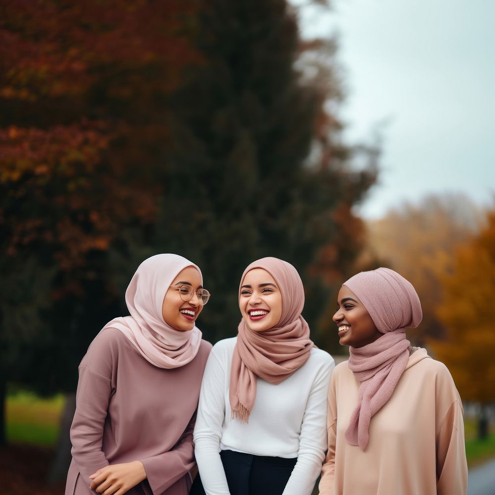 Muslim women laughing outdoors adult. 