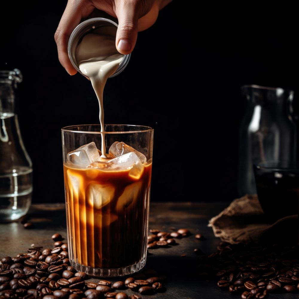 Iced coffee pouring drink food. AI generated Image by rawpixel.