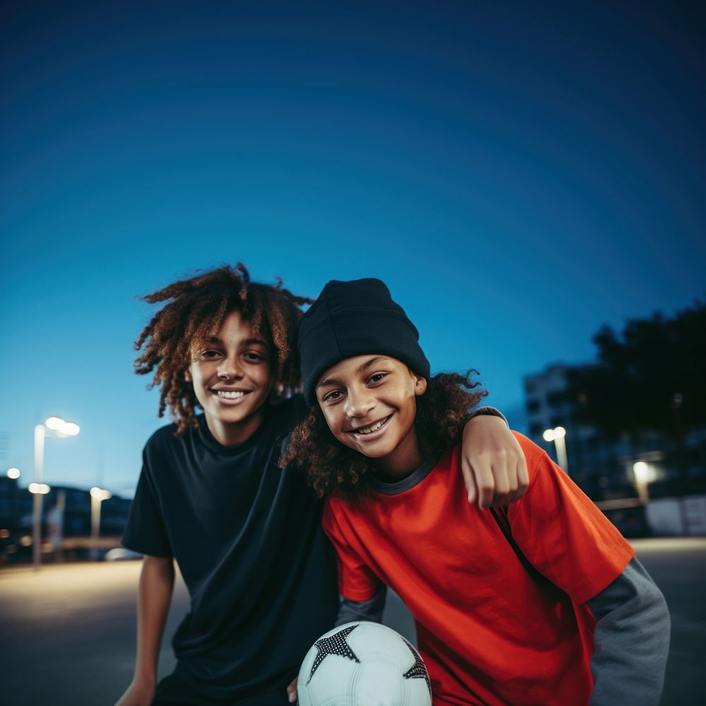 Two diversity cool kids playing sport sports photography football. AI generated Image by rawpixel.
