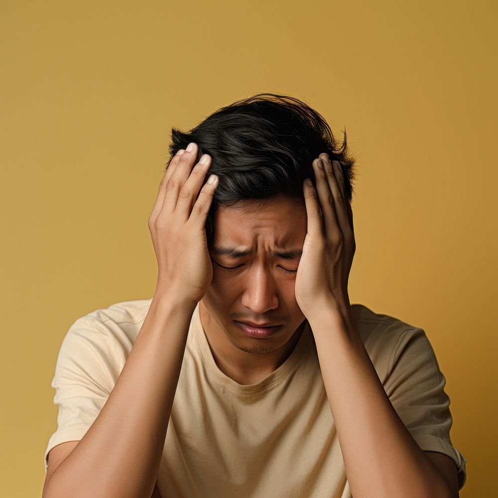 Asian man distressed worried adult pain. AI generated Image by rawpixel.