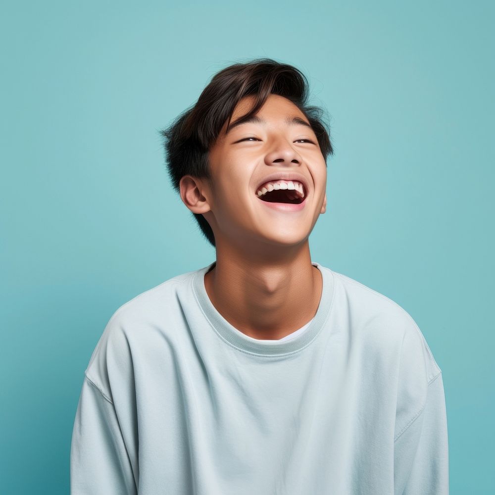 Teenaged boy laughing smile excitement relaxation. AI generated Image by rawpixel.
