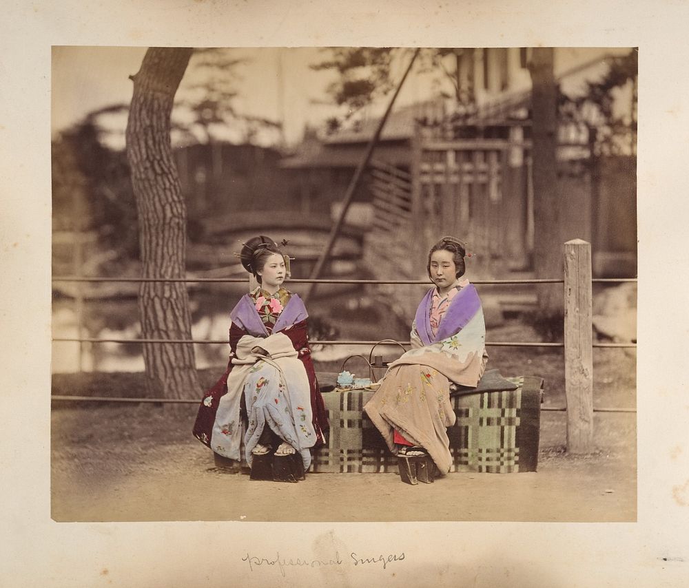 Two Japanese Women Sitting on a Bench