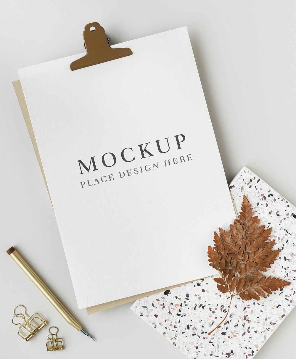 White paper template mockup with dried leaves