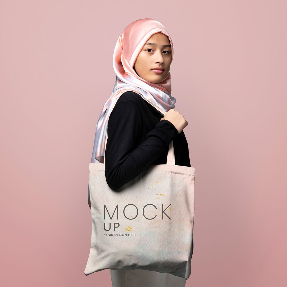 Muslim woman carrying a tote bag mockup