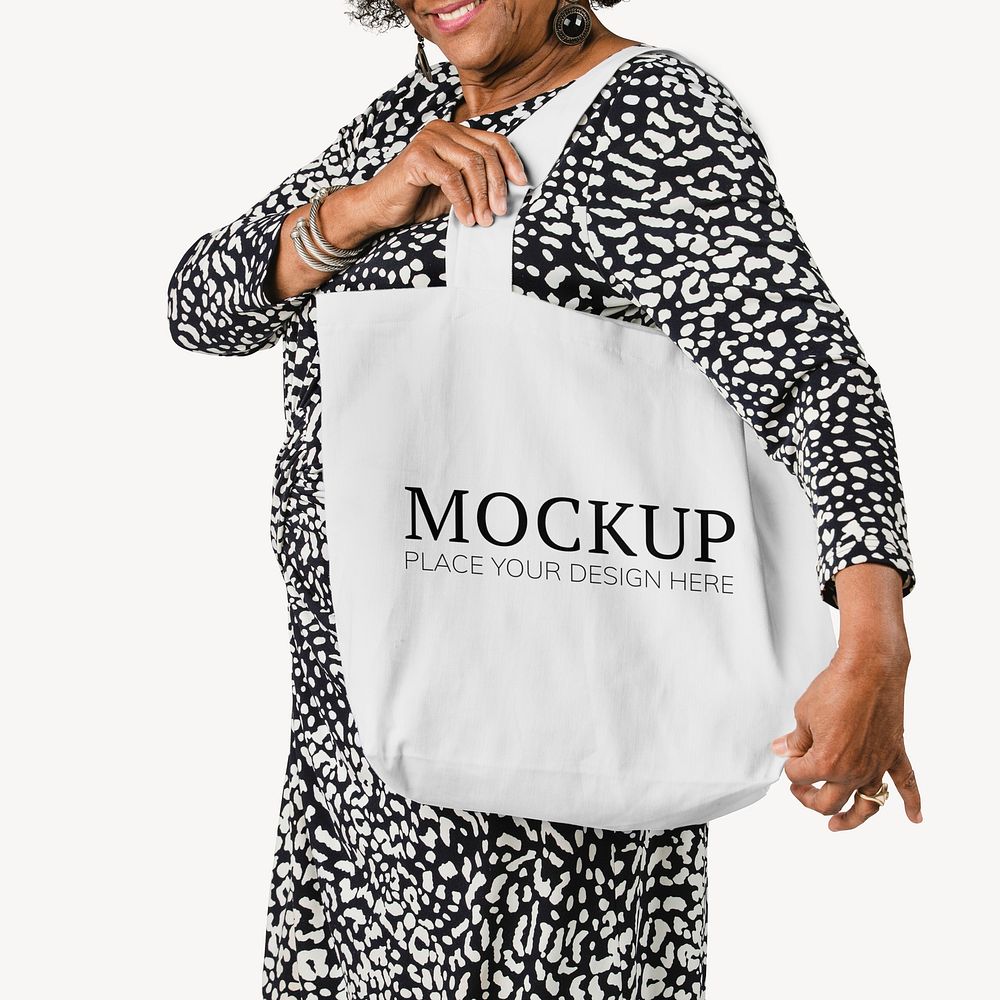 Senior woman holding a tote bag mockup