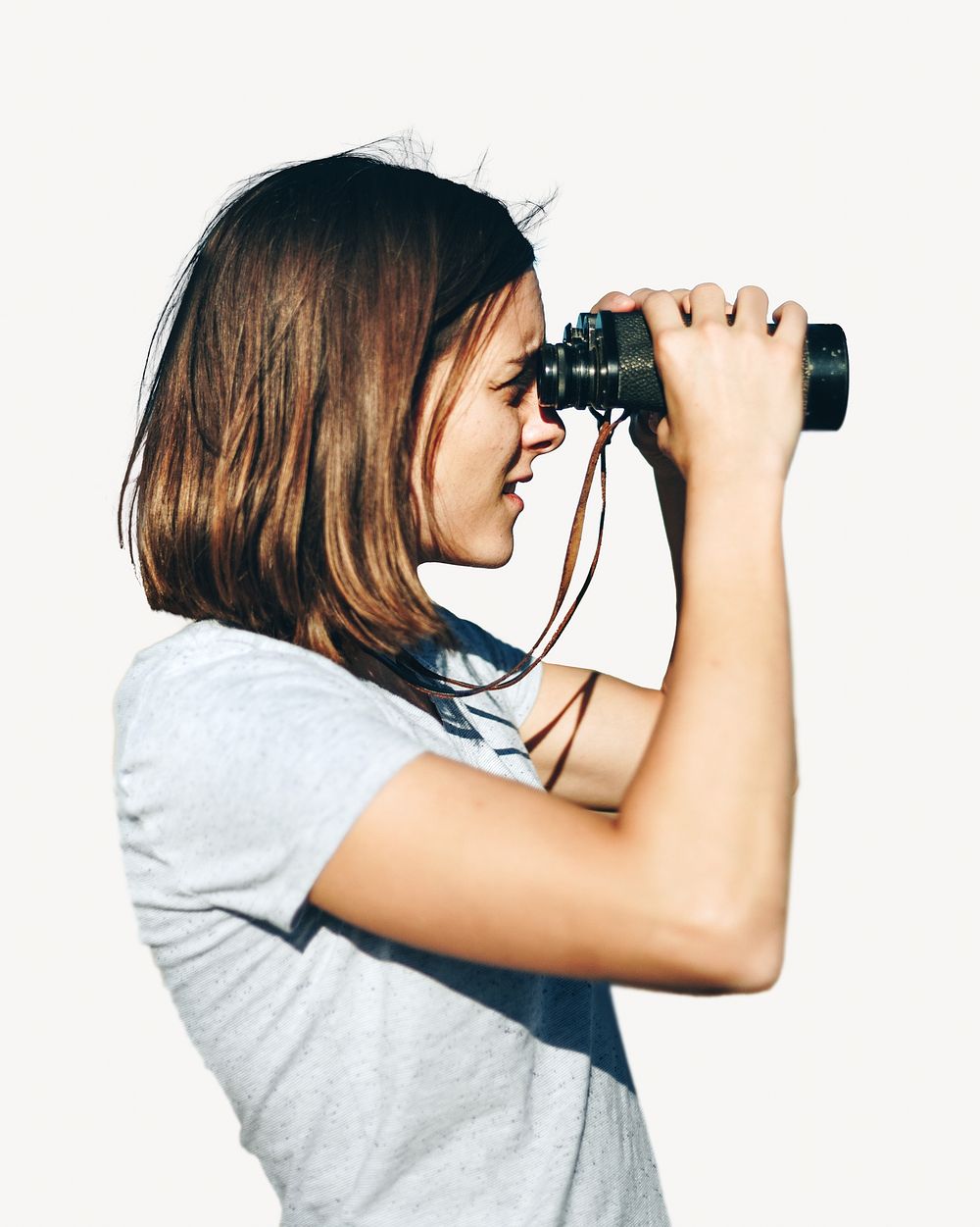 Woman using binoculars, isolated image