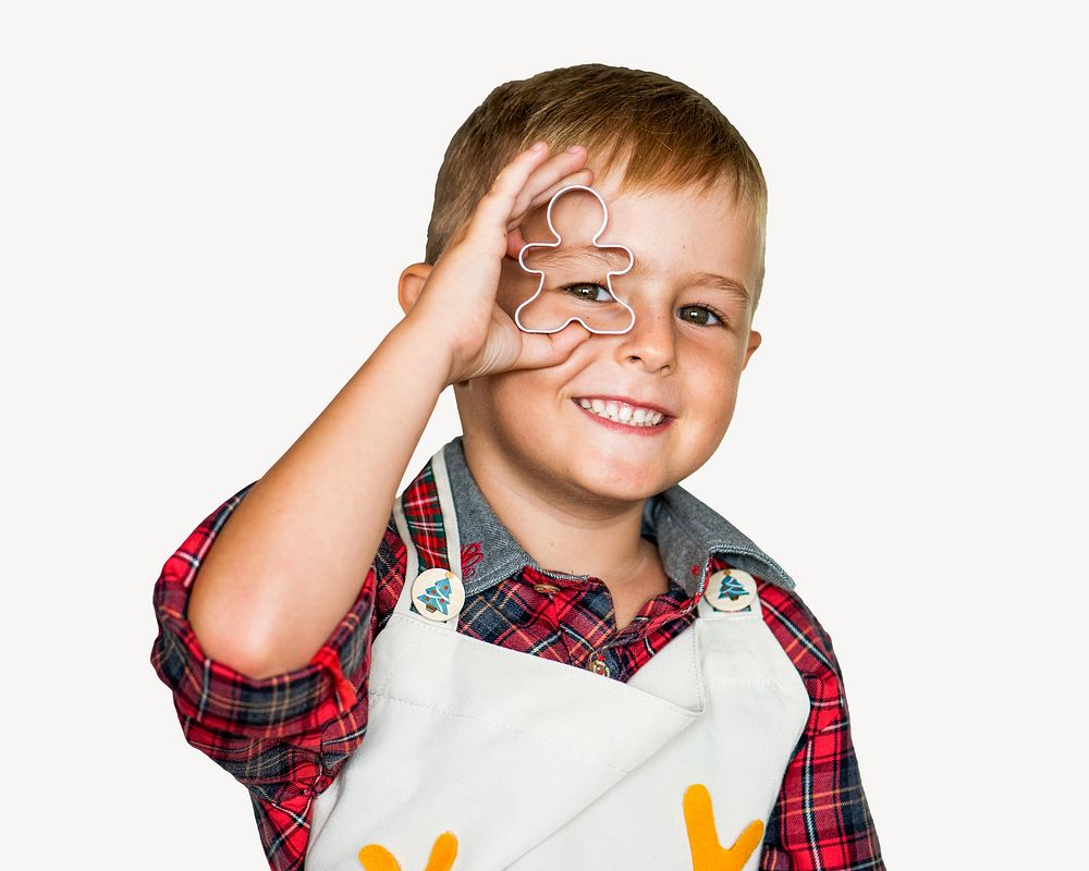 Boy holding cookie cutter, isolated image