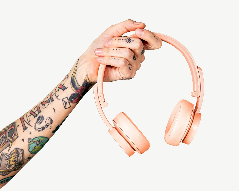 Tattooed arm holding pink headphones collage element psd