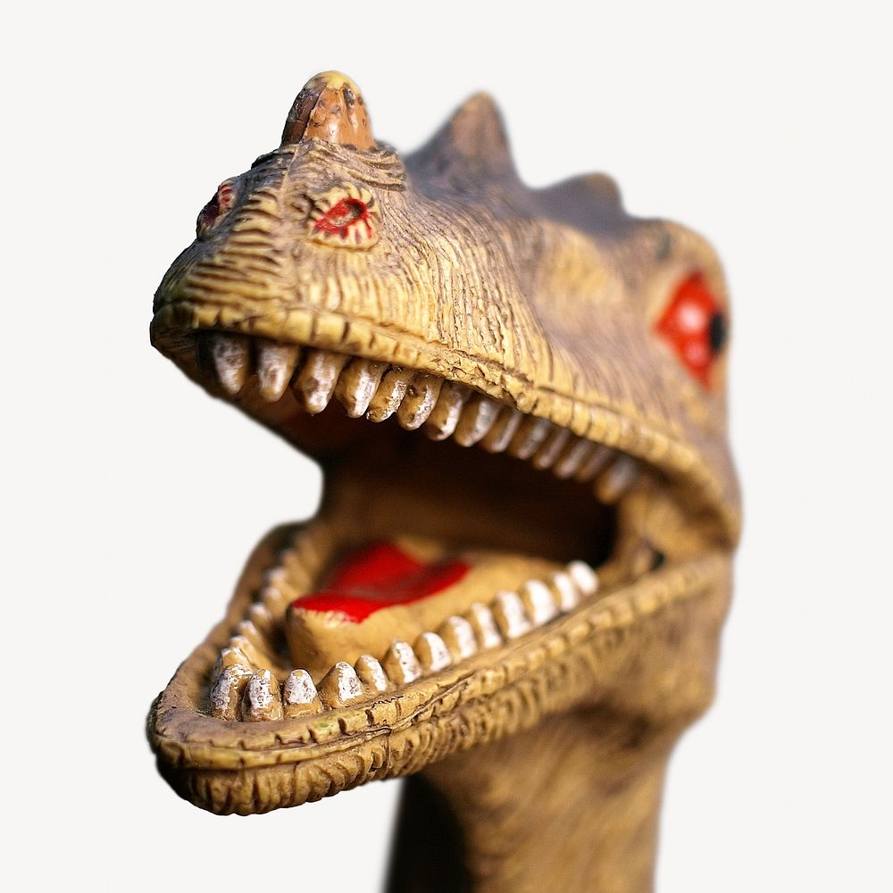Plastic dinosaur toy with the paint wearing off isolated image