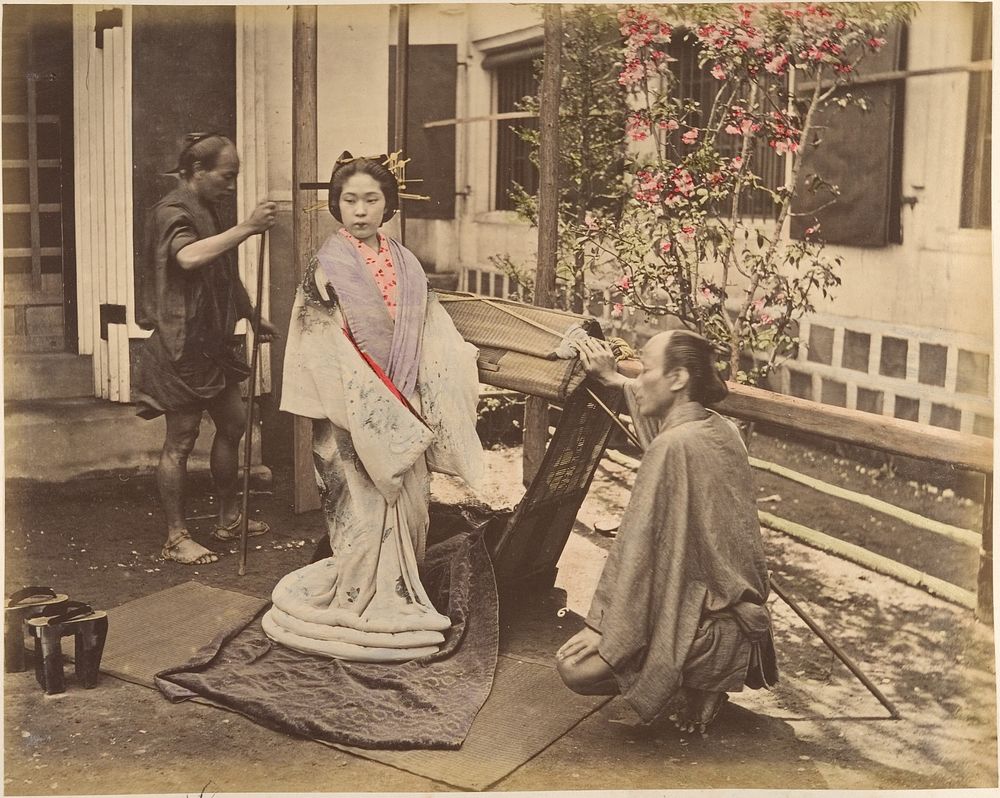 Japanese Woman in Traditional Dress Posing with Two Men by Unknown