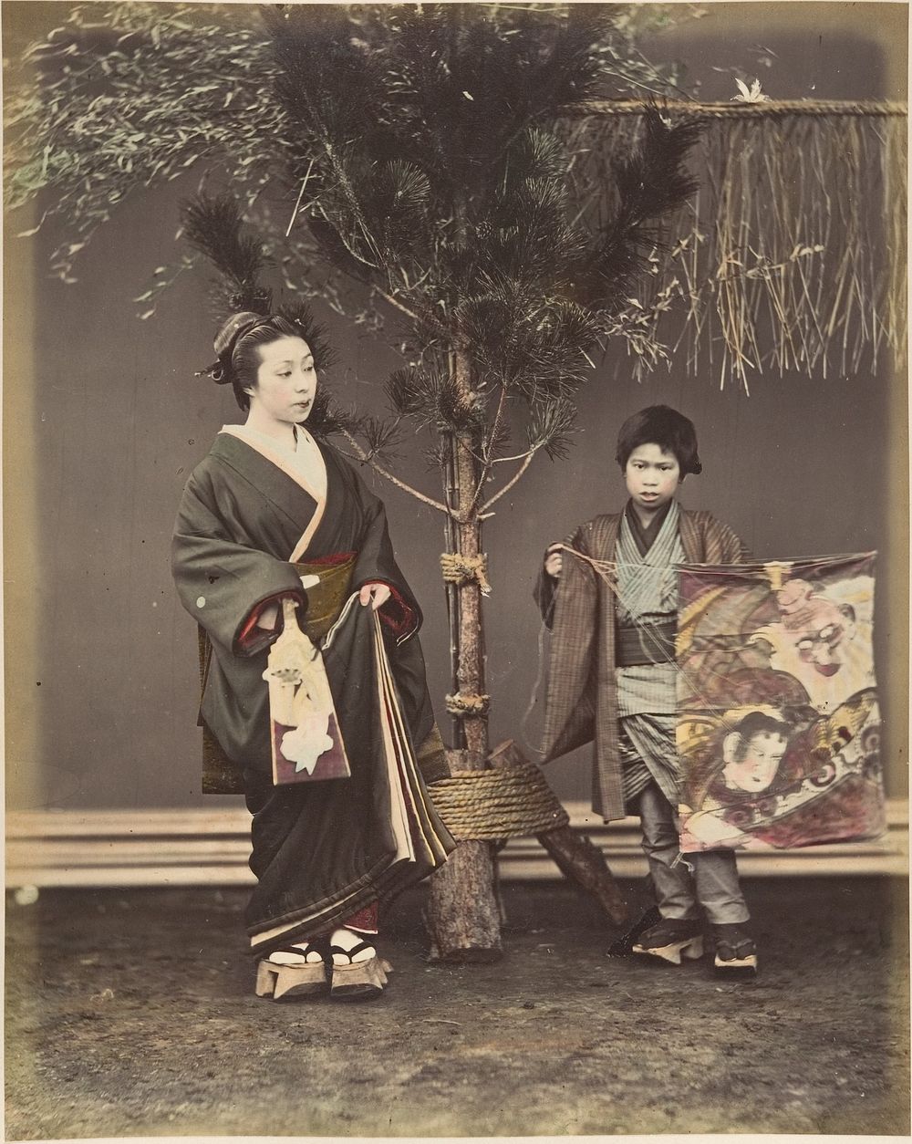 A Japanese Woman and a Japanese Boy in Traditional Dress by Suzuki Shin'ichi