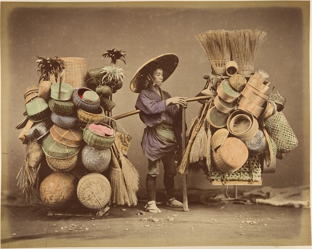 Japanese Man Posing with Baskets, Brooms and Feather Dusters  by Unknown