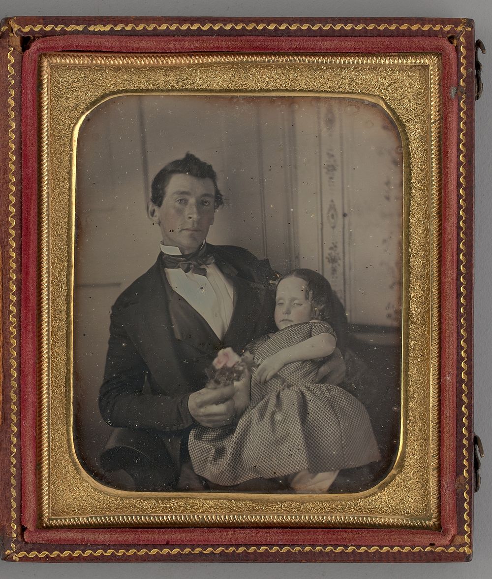 Untitled (Portrait of man Holding a Girl) by Unknown Maker