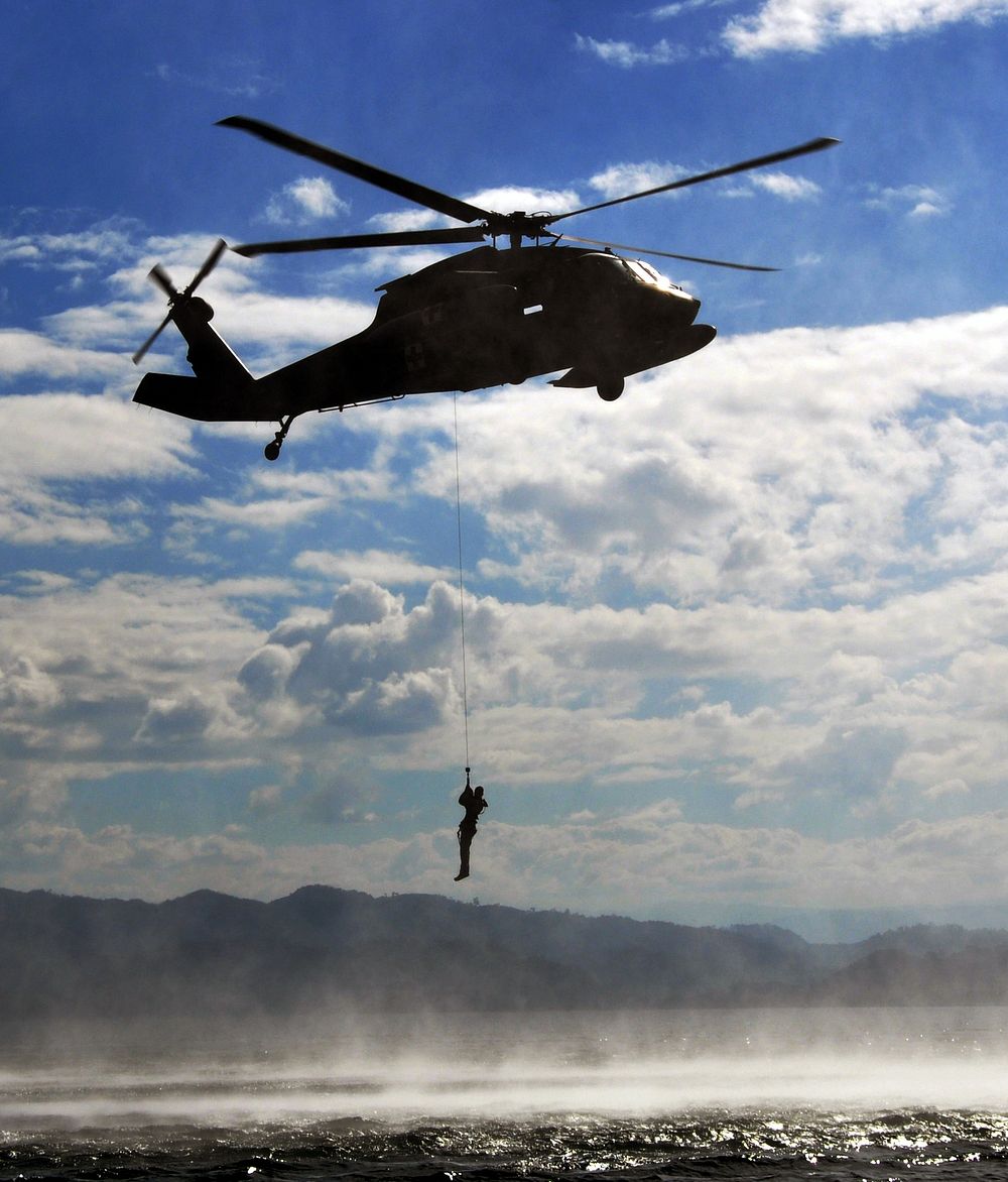 A U.S. Service member with Joint Task Force (JTF)-Bravo is hoisted from the waters of Lake Yojoa, Honduras, Feb. 25, 2014…