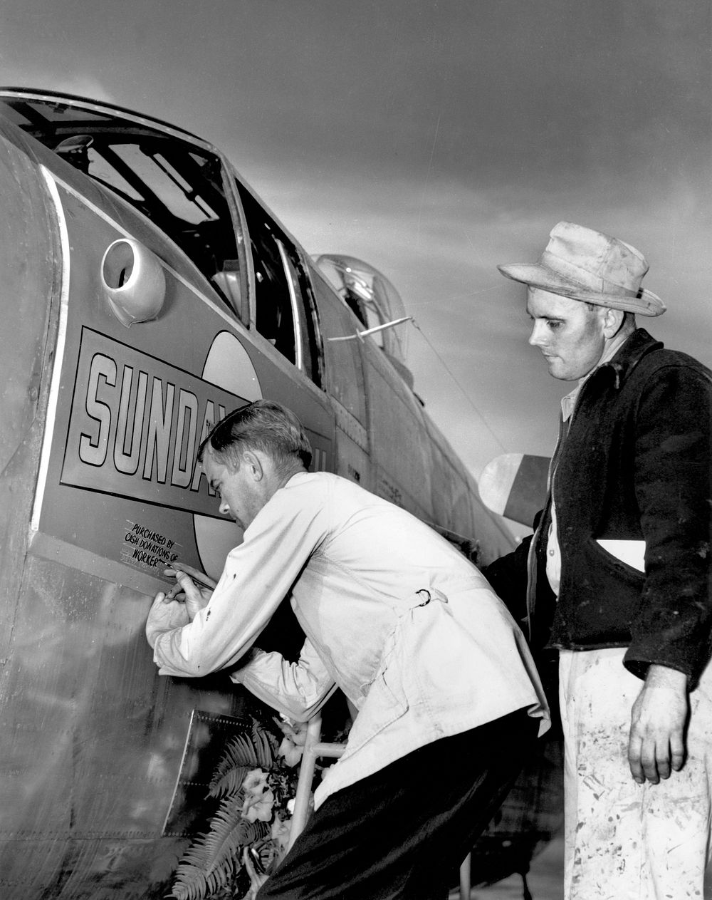 Name being added to the "Sunday Punch" Mitchell B-25 Bomber 1945 McGhee Tyson Air Port