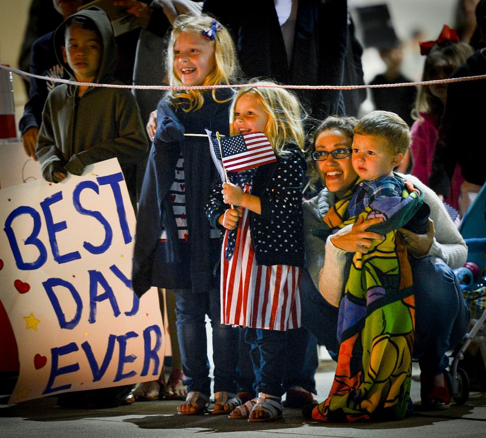 Family members await the return of deployed U.S. Airmen with the 20th Fighter Wing at Shaw Air Force Base, S.C., April 13…