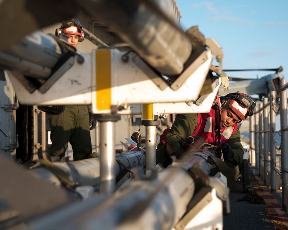 U.S. Marine Corps Cpl. Iquan Strickland, from Harrisburg, Pennsylvania, prepares to load Captive Air Training Missiles…