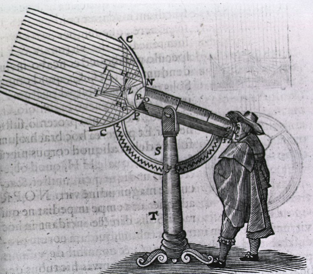 An Early Telescope. A man is looking through a telescope, the parts of which are lettered for further identification and…