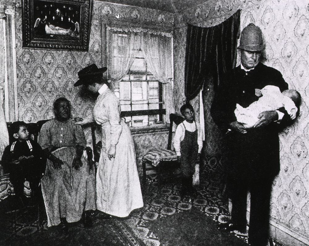 Public Health: Visiting nurse comforts mother as policeman takes baby to the hospital. Interior scene: Visiting nurse…