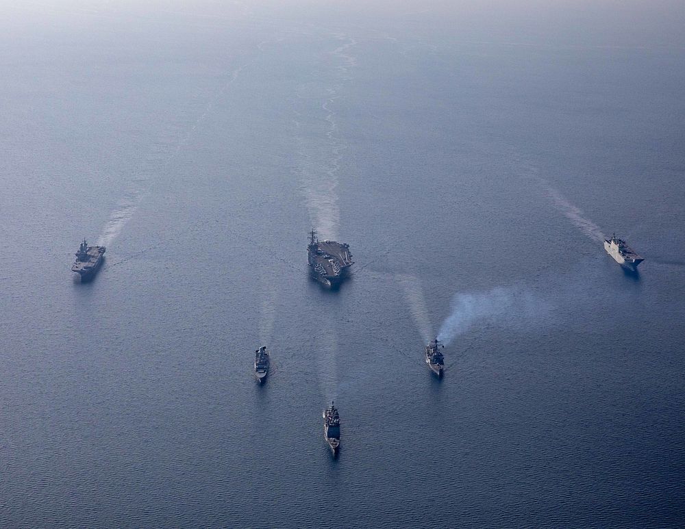 ADRIATIC SEA (Feb. 24, 2023) The Italian Navy aircraft carrier ITS Cavour (CVH 550), top left, the Nimitz-class aircraft…