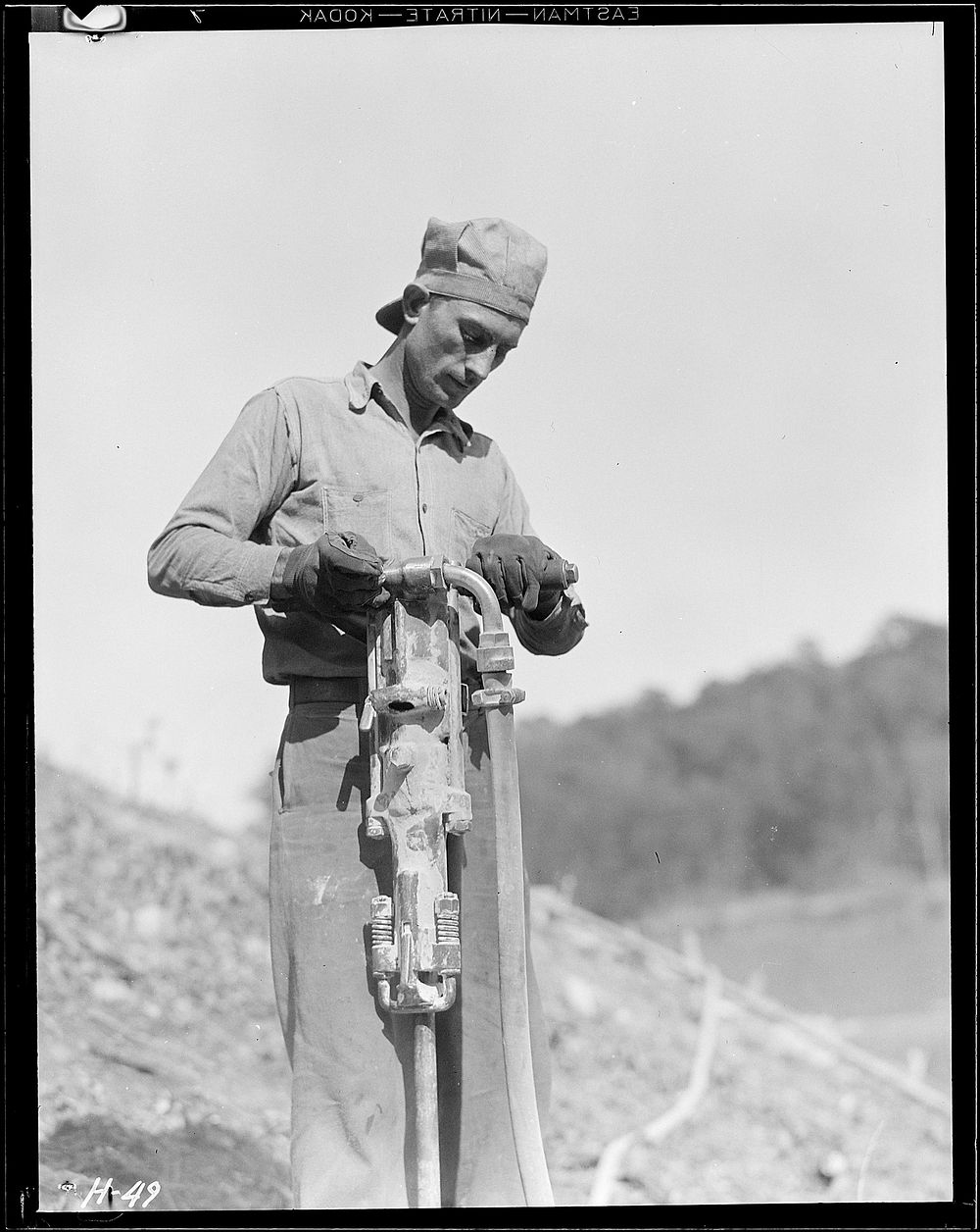 Rock-driller at Norris Dam site, October 1933. Photographer: Hine, Lewis. Original public domain image from Flickr