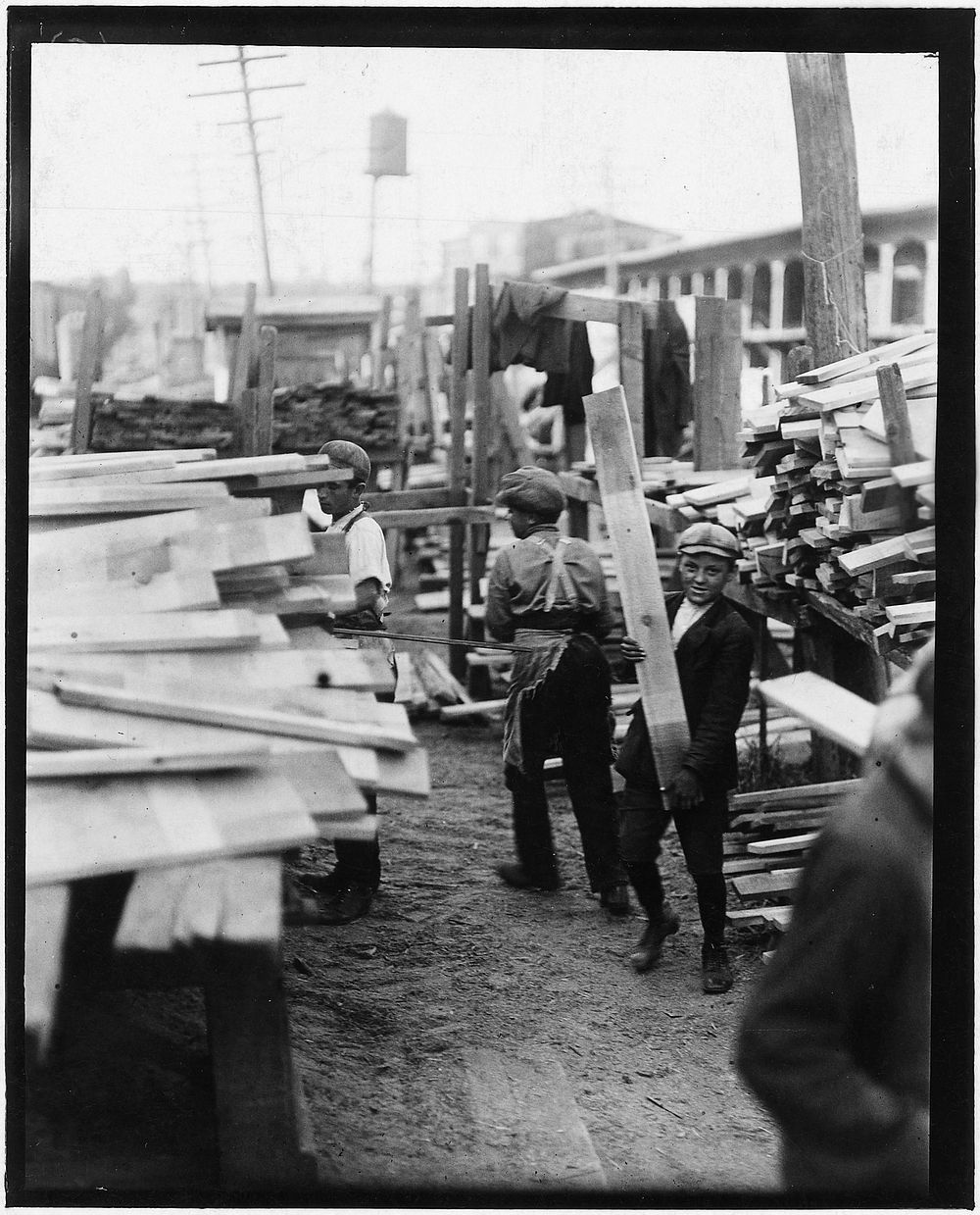 Young boy working for Hickok Lumber Co. Burlington, Vt, September 1910. Photographer: Hine, Lewis. Original public domain…