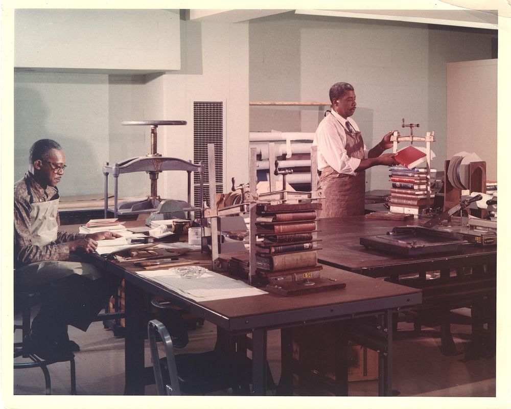 Binding section, National Library of Medicine. Interior view of the Binding Section. Mr. Holman operates the press. Mr.…