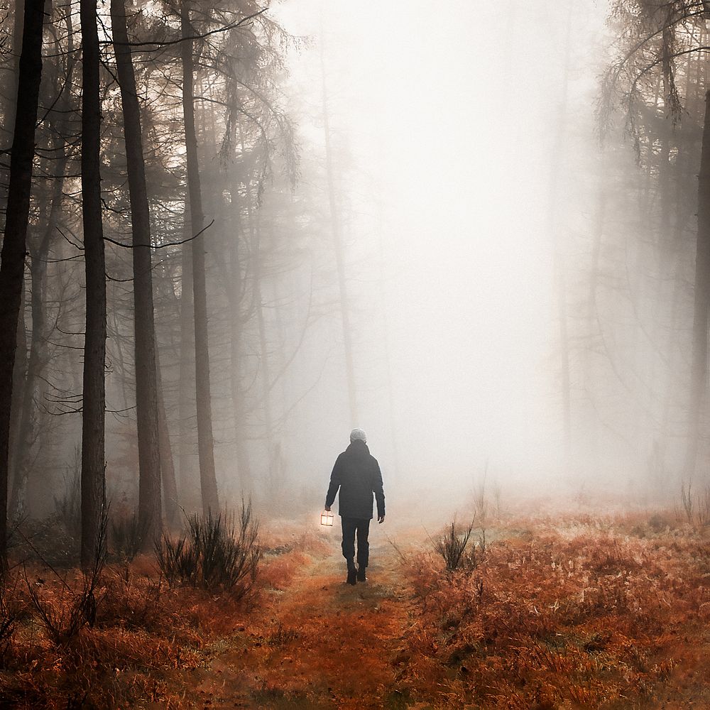 Man walking in mist background design