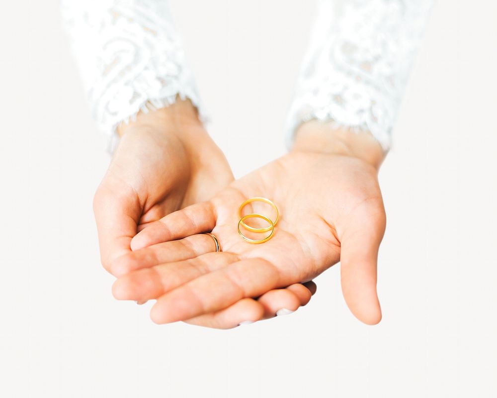 Hand holding rings isolated image on white