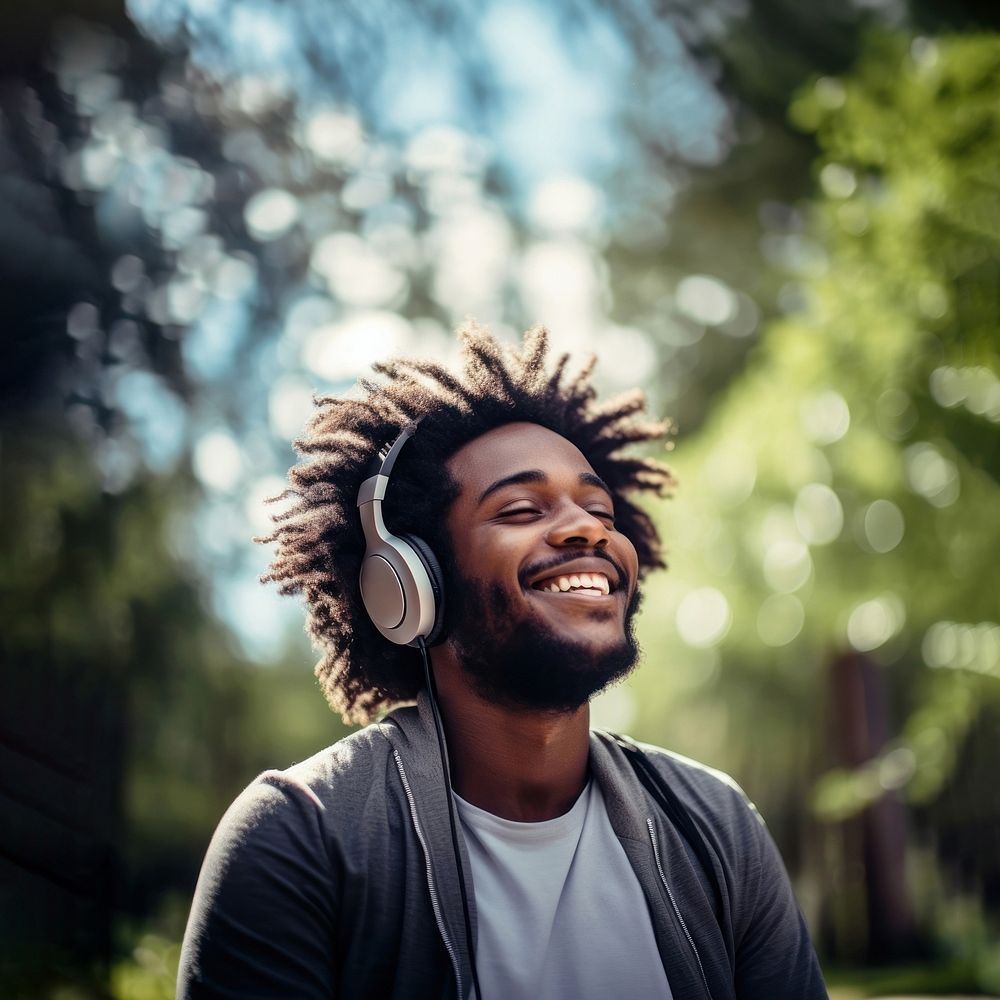 Happy man headphones listening outdoors.  