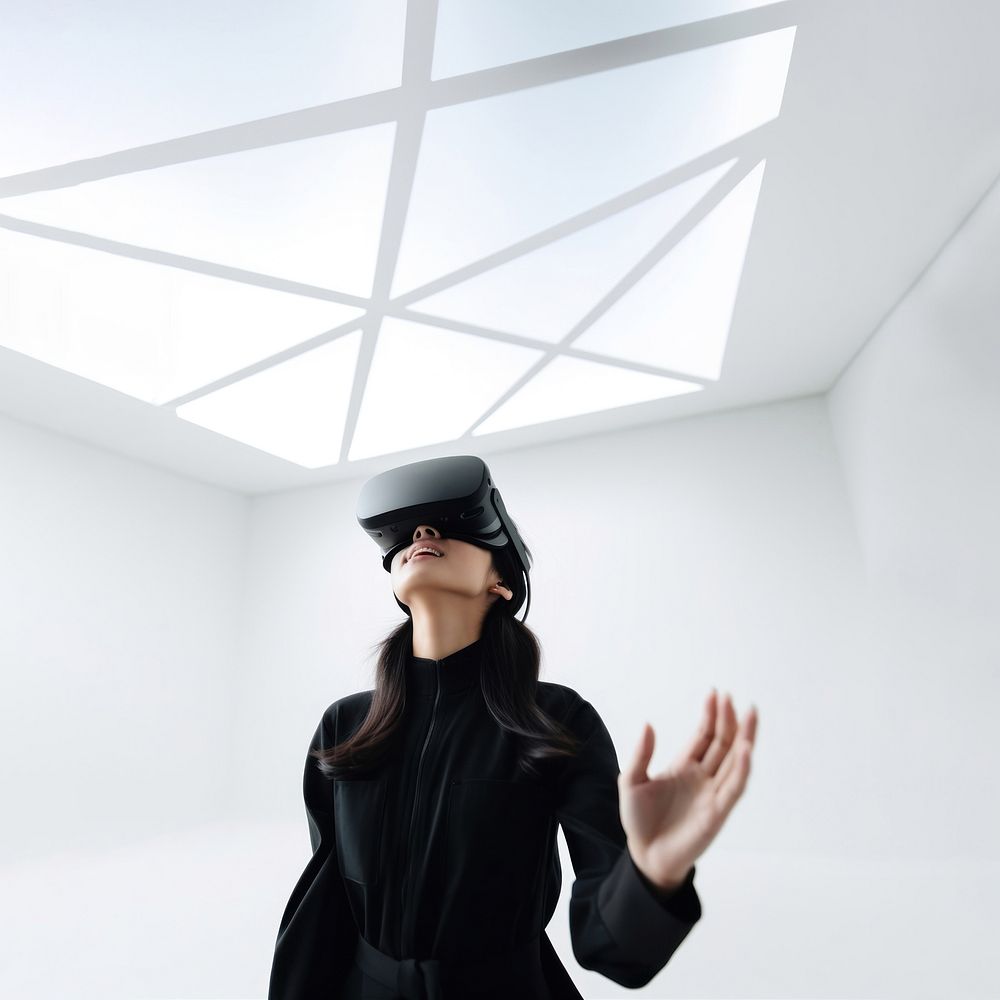 South-East asian girl playing VR game wearing all black outfit. 