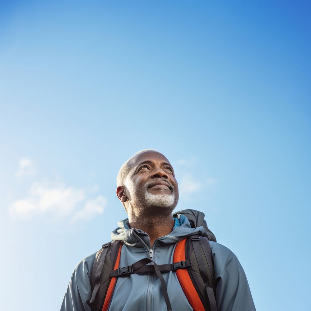 Senior man hiking portrait backpack looking. 